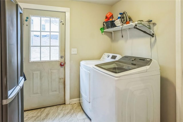 laundry room featuring separate washer and dryer