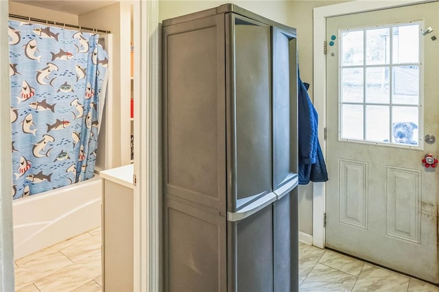 bathroom with vanity and shower / tub combo with curtain