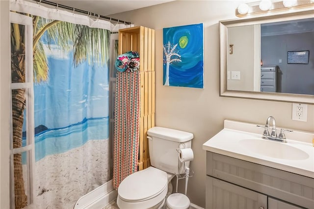 bathroom featuring vanity and toilet