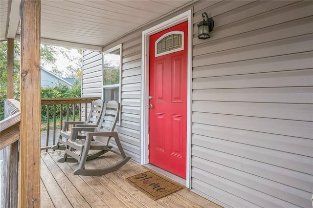 view of exterior entry with covered porch