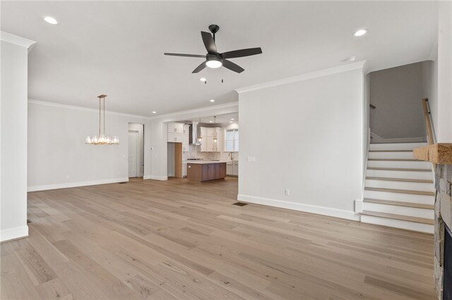 unfurnished living room with ceiling fan, light hardwood / wood-style flooring, and ornamental molding