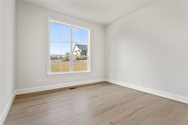 unfurnished room featuring light wood-type flooring