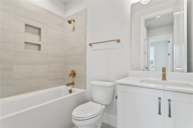 full bathroom with vanity, toilet, and tiled shower / bath