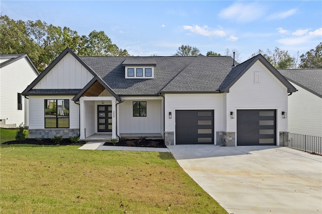 modern farmhouse with french doors and a front lawn