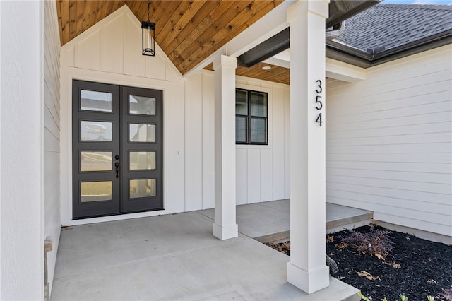 entrance to property featuring french doors and covered porch