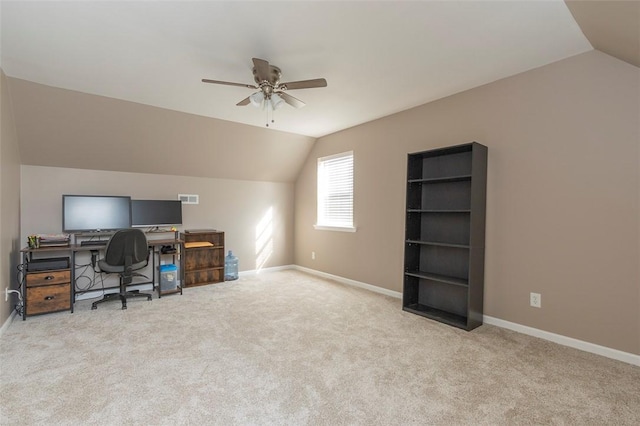 carpeted office featuring ceiling fan and lofted ceiling