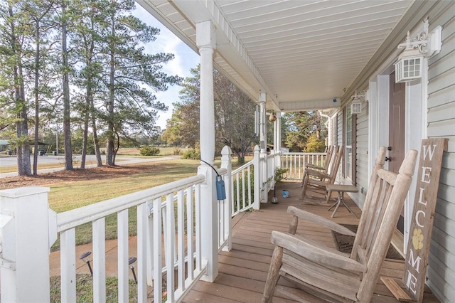 wooden terrace featuring a porch