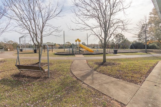 view of community with a yard and a playground