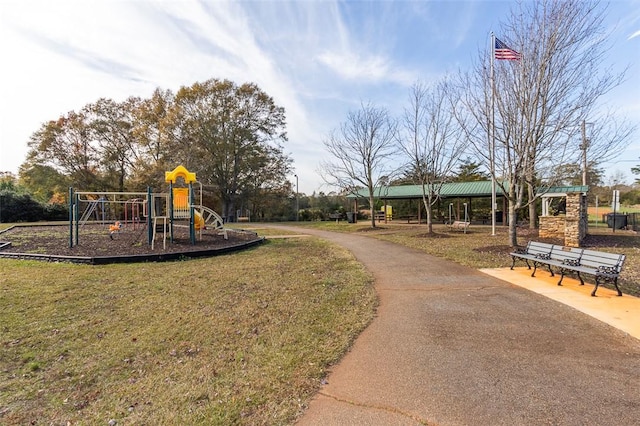 view of jungle gym featuring a lawn