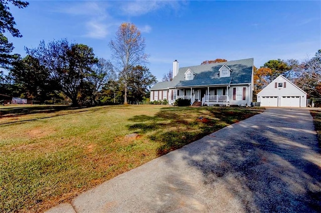 cape cod house featuring driveway, an outbuilding, a porch, and a front yard