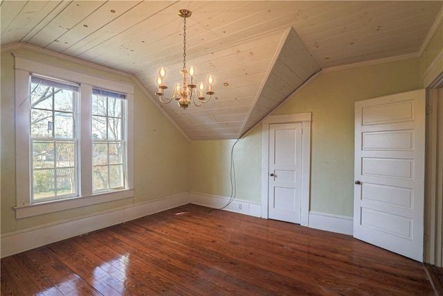 additional living space featuring vaulted ceiling, plenty of natural light, dark wood finished floors, and a notable chandelier