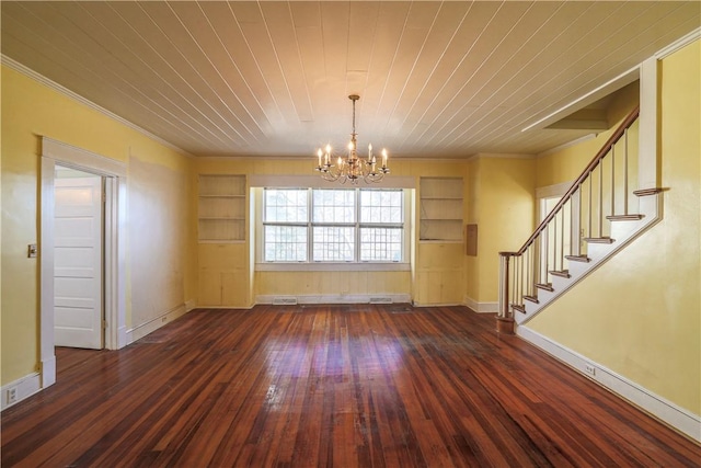 interior space with built in shelves, stairway, dark wood finished floors, and an inviting chandelier