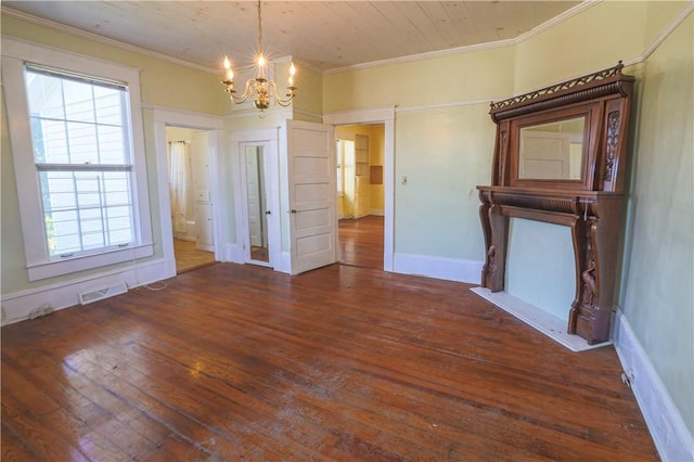 unfurnished dining area featuring a notable chandelier, dark wood finished floors, visible vents, and crown molding