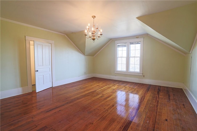 bonus room featuring vaulted ceiling, dark wood-style flooring, a notable chandelier, and baseboards