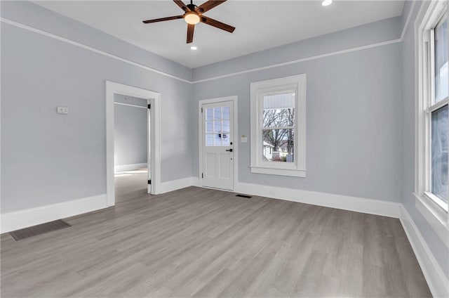 foyer entrance featuring baseboards, visible vents, a ceiling fan, wood finished floors, and recessed lighting