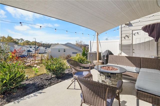 view of patio / terrace featuring an outdoor living space with a fire pit