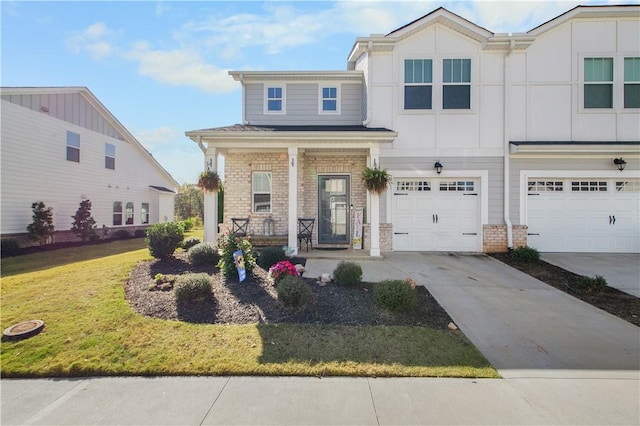 view of front of house featuring a porch, a garage, and a front lawn