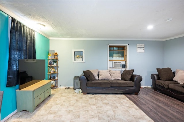 living room featuring light hardwood / wood-style flooring, cooling unit, and ornamental molding