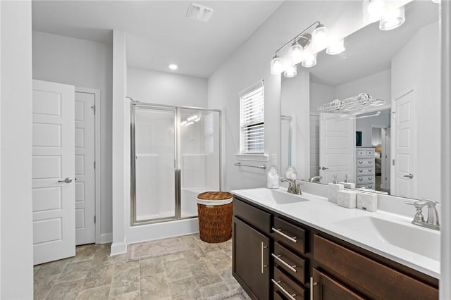 bathroom featuring vanity and walk in shower