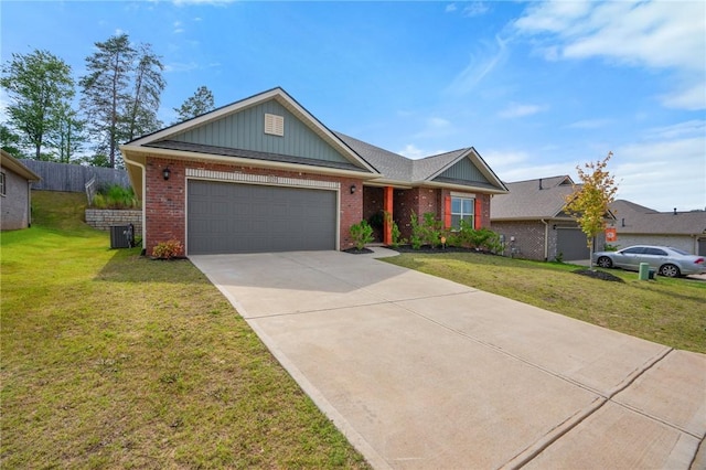 ranch-style house featuring cooling unit, a front yard, and a garage