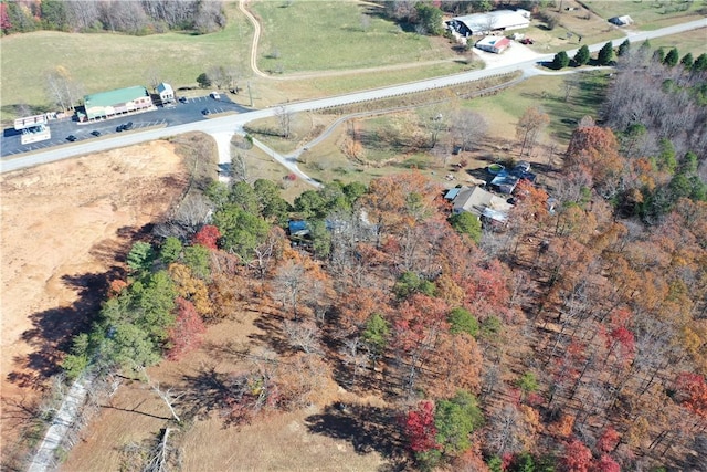 birds eye view of property with a rural view