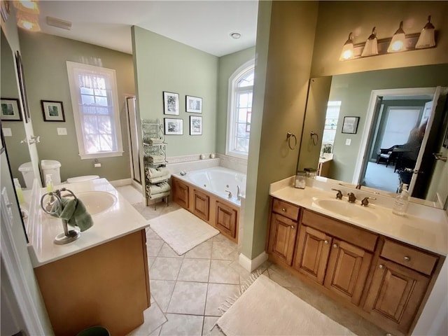 bathroom featuring tile patterned floors, vanity, and independent shower and bath