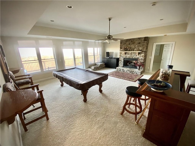 rec room featuring a raised ceiling, a wealth of natural light, light carpet, and pool table