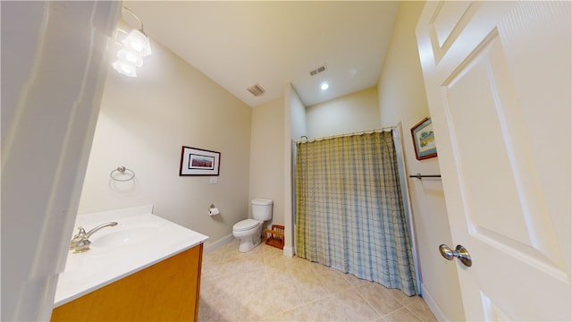 bathroom with tile patterned floors, vanity, toilet, and a shower with curtain