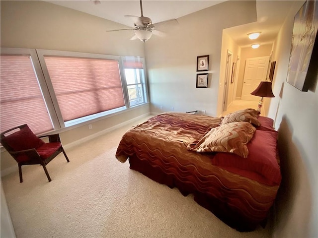 bedroom featuring ceiling fan and carpet