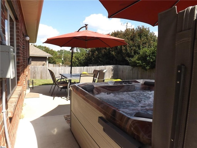 view of patio with a hot tub