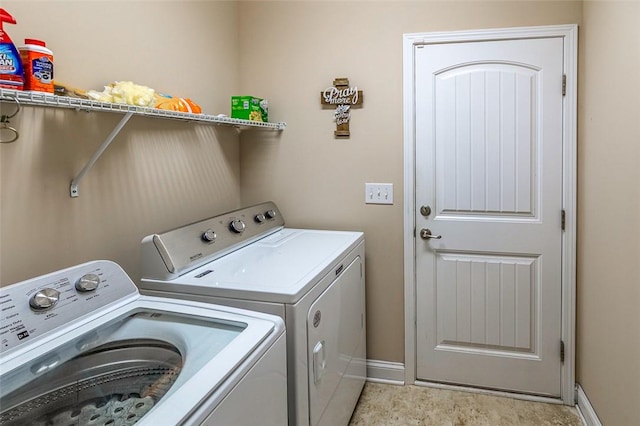 washroom featuring washing machine and dryer