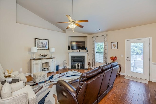 living room with lofted ceiling, ceiling fan, and dark hardwood / wood-style floors