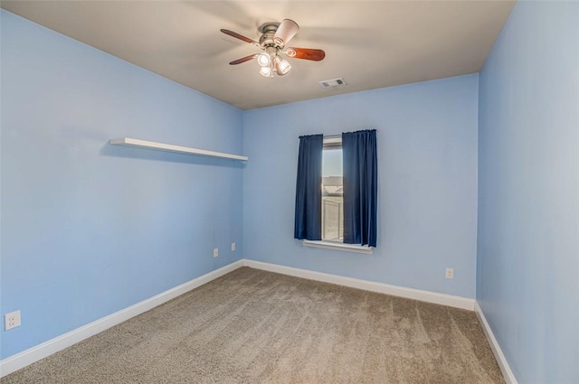 empty room with carpet floors and ceiling fan