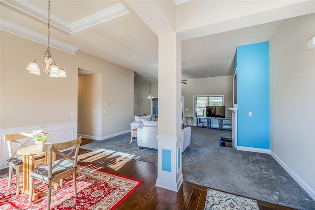 interior space with ornamental molding, dark wood-type flooring, and a notable chandelier