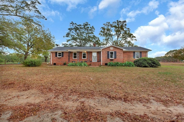 ranch-style house featuring a front lawn