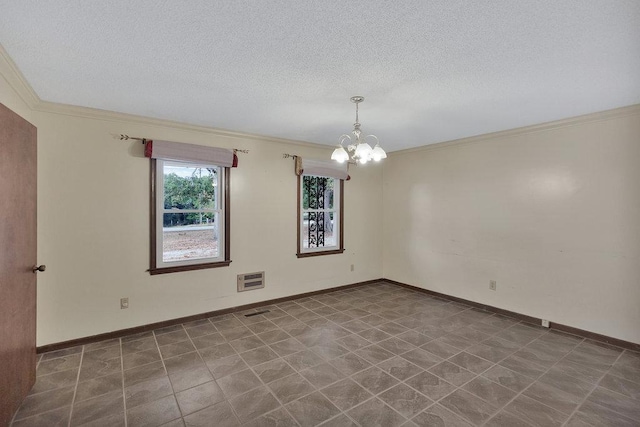 spare room featuring a textured ceiling, crown molding, and an inviting chandelier