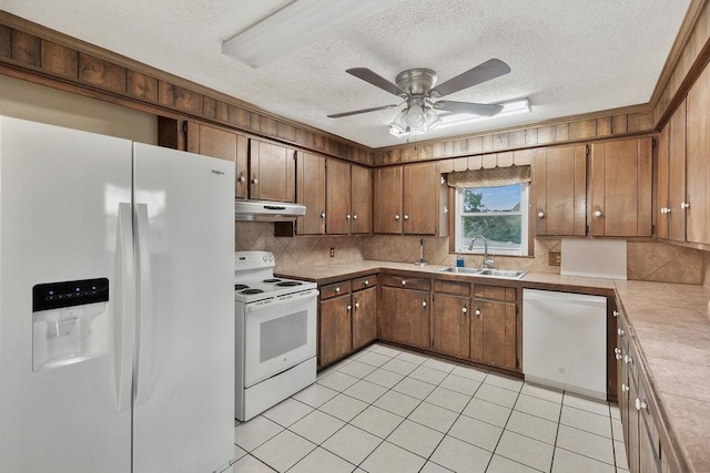 kitchen with backsplash, white appliances, ceiling fan, sink, and light tile patterned floors