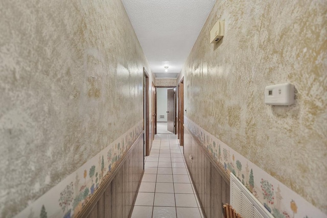 corridor featuring light tile patterned floors