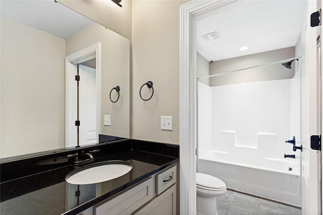 full bathroom featuring vanity, toilet, and tub / shower combination