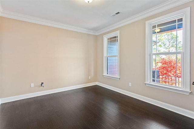 spare room featuring crown molding and wood-type flooring