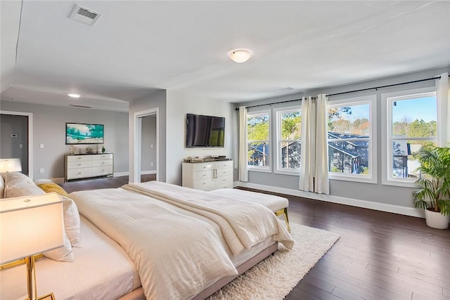 bedroom featuring dark hardwood / wood-style flooring