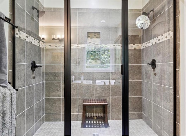 bathroom featuring a shower with shower door