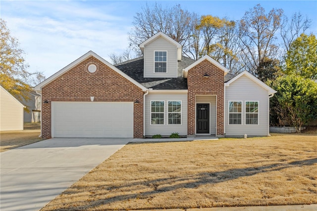 view of front of property with a garage and a front yard