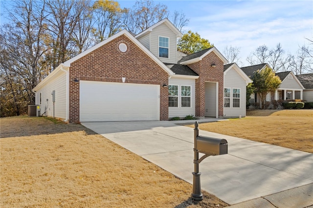 view of front facade featuring central AC unit, a garage, and a front lawn