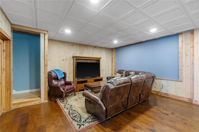 living room featuring wood walls and dark wood-type flooring