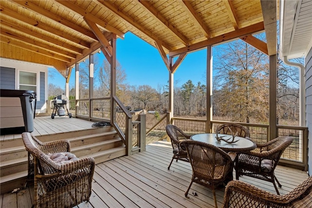 wooden terrace with a grill