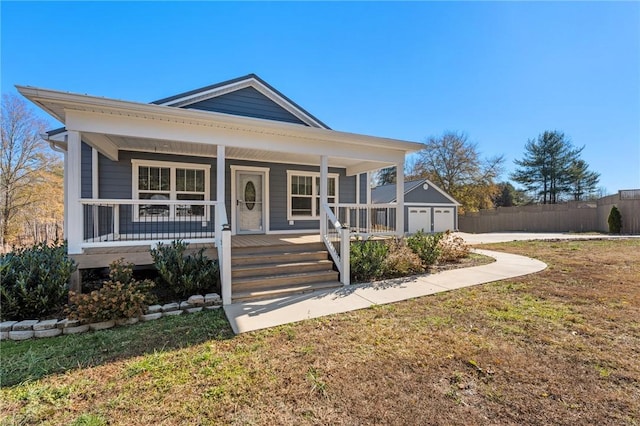 view of front of property with a porch and a front lawn