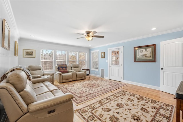 living room with ceiling fan, wood-type flooring, and ornamental molding