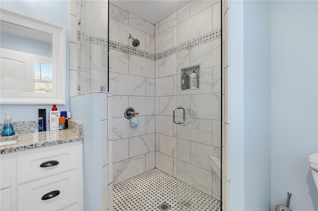 bathroom featuring vanity and an enclosed shower