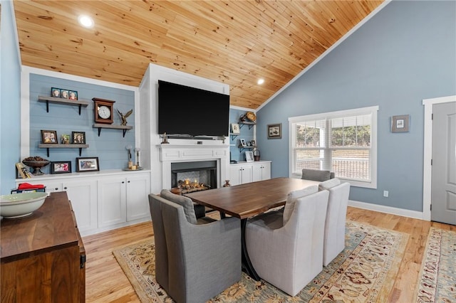 dining area featuring light wood-type flooring, high vaulted ceiling, and wooden ceiling